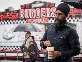 NDP Leader Jagmeet Singh eats popcorn during a visit to the Rumble on Gray Street Fair, in Burnaby, B.C., on Saturday September 15, 2018. The New Democrat's latest fundraising effort promises that "core supporters" will match every dollar other contributors make to the party's cause.