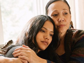 Actors Tanaya Beatty, left, and Tina Keeper are shown in a scene from the movie "Through Black Spruce" in this handout image. When it came to choosing a director for her new Indigenous-focused drama "Through Black Spruce," Cree producer-actor Tina Keeper says she felt fortunate to land Toronto filmmaker Don McKellar.