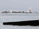 An Air Niugini plane sits in a lagoon after crash-landing near Chuuk Airport in Weno, Micronesia, Sept. 28, 2018.