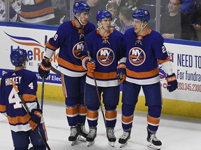 New York Islanders' Anthony Beauvillier, center, celebrates his second goal with teammates Brock Nelson, left, and Anders Lee, right, during the second period of a preseason NHL hockey game against the New York Rangers, Saturday, Sept. 22, 2018, in Bridgeport, Conn.