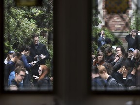 Yale University law students, faculty and staff gather in the courtyard of the Sterling Law Building in New Haven, Conn., Monday, Sept. 24, 2018, after walking out of class in protest of Brett Kavanaugh's nomination for the Supreme Court in response to sexual misconduct allegations.