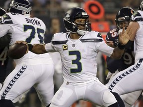 Seattle Seahawks quarterback Russell Wilson (3) throws a pass during the first half of an NFL football game against the Chicago Bears Monday, Sept. 17, 2018, in Chicago.