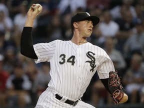Chicago White Sox starting pitcher Michael Kopech throws to a Boston Red Sox batter during the first inning of a baseball game Friday, Aug. 31, 2018, in Chicago.