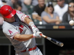 Los Angeles Angels' Mike Trout hits a single against the Chicago White Sox during the sixth inning of a baseball game Sunday, Sept. 9, 2018, in Chicago.