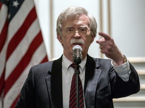 National security adviser John Bolton calls on a reporter during a news conference after speaking at a Federalist Society luncheon at the Mayflower Hotel, Monday, Sept. 10, 2018, in Washington.