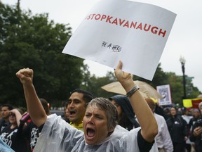 Protesters march from the Supreme Court to Hart Senate Office Building on Capitol Hill in Washington, Monday, Sept. 24, 2018. A second allegation of sexual misconduct has emerged against Judge Brett Kavanaugh, a development that has further imperiled his nomination to the Supreme Court, forced the White House and Senate Republicans onto the defensive and fueled calls from Democrats to postpone further action on his confirmation. President Donald Trump is so far standing by his nominee.