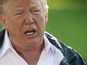 President Donald Trump talks to media before boarding Marine One on the South Lawn of the White House in Washington, Wednesday, Sept. 19, 2018, for the short trip to Andrews Air Force Base en route to Havelock, N.C.