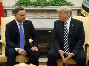 President Donald Trump talks with Polish President Andrzej Duda during a meeting in the Oval Office of the White House, Tuesday, Sept. 18, 2018, in Washington.