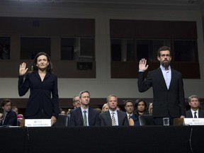 Facebook COO Sheryl Sandberg, left, accompanied by Twitter CEO Jack Dorsey are sworn in before the Senate Intelligence Committee hearing on 'Foreign Influence Operations and Their Use of Social Media Platforms' on Capitol Hill, Wednesday, Sept. 5, 2018, in Washington.