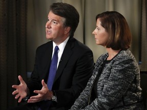 Brett Kavanaugh, with his wife Ashley Estes Kavanaugh, answers questions during a FOX News interview, Monday, Sept. 24, 2018, in Washington, about allegations of sexual misconduct against the Supreme Court nominee.