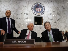 Sen. Orrin Hatch, R-Utah, center, and Sen. John Kennedy, R-La., wait during an evening break in testimony of President Donald Trump's Supreme Court nominee, Brett Kavanaugh, before the Senate Judiciary Committee on Capitol Hill in Washington, Wednesday, Sept. 5, 2018, on the second day of his confirmation hearing to replace retired Justice Anthony Kennedy.