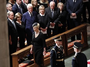 Cindy McCain arrives at a memorial service for her husband, Sen. John McCain, R-Ariz., at the Washington National Cathedral in Washington, Saturday, Sept. 1, 2018. McCain died Aug. 25, from brain cancer at age 81. Watching in the front row from left are President George W. Bush, former first lady Laura Bush, former President Bill Clinton, former Secretary of State Hillary Clinton, former Vice President Dick Cheney and his wife Lynne.