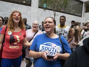 Protesters opposed to President Donald Trump's Supreme Court nominee, Brett Kavanaugh, demonstrate in the Hart Senate Office Building on Capitol Hill in Washington, Thursday, Sept. 20, 2018.