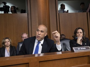 Sen. Cory Booker, D-N.J., and Sen. Kamala Harris, D-Calif., right, and other Democrats on the Senate Judiciary Committee appeal to Chairman Chuck Grassley, R-Iowa, to delay the confirmation hearing of President Donald Trump's Supreme Court nominee, Brett Kavanaugh, on Capitol Hill in Washington, Tuesday, Sept. 4, 2018.
