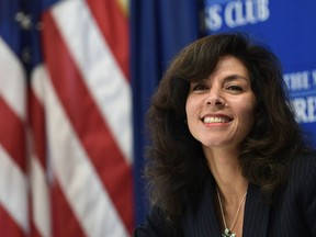 Ashley Tabaddor, a federal immigration judge in Los Angeles who serves as the President of the National Association of Immigration Judges, listens as she is introduced to speak at the National Press Club​ in Washington, Friday, Sept. 21, 2018, on the pressures on judges and the federal immigration court system.