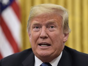 President Donald Trump talks about Hurricane Florence following a briefing in the Oval Office of the White House in Washington, Tuesday, Sept. 11, 2018.