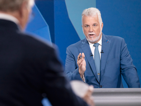 Liberal leader Philippe Couillard addresses PQ leader Jean-Francois Lisee during the leaders debate Sept. 13, 2018 in Montreal.