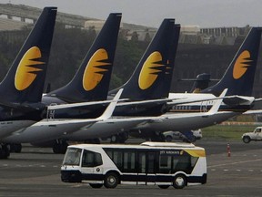 FILE - In this Sept. 9, 2009 file photo, Jet Airways aircrafts sit on the tarmac at the Santacruz domestic airport terminal in Mumbai, India. A Jet Airways flight returned to Mumbai, India's financial capital, on Thursday, Sept. 20, 2018, after dozens of passengers complained of ear pain and nose bleeding due to the loss in cabin pressure.