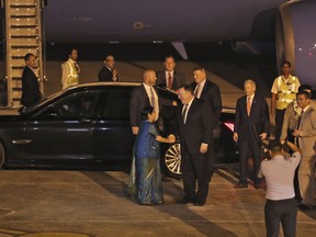 U.S. Secretary of State Mike Pompeo, right, is greeted by Indian External Affairs Minister Sushma Swaraj upon arrival at the airport in New Delhi, India, Wednesday, Sept. 5, 2018.