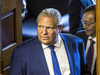 Ontario Premier Doug Ford looks into the chamber during an interruption by hecklers during the morning session in the legislature at Queen’s Park in Toronto, Sept. 12, 2018.