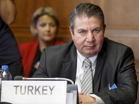 Turkish Foreign Ministry Deputy Sedat Onal attends a meeting during the consultations on Syria, at the European headquarters of the United Nations in Geneva, Switzerland, Tuesday, Sept. 11, 2018. Representatives of Russia, Turkey and Iran, meet with the UN Special Envoy of the Secretary-General for Syria to discuss the situation in Syria.