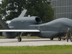 FILE-- In this Thursday, July 21, 2011 photo a recce drone 'Euro Hawk' is moved at the air base in Manching, Germany. Germany wants to sell a second-hand drone that's cost the country over 700 million euros ($823 million) to Canada, without many core components it needs to fly.