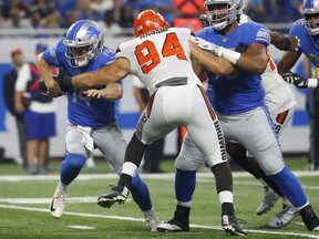 Cleveland Browns defensive end Carl Nassib (94) knocks the ball away from Detroit Lions quarterback Jake Rudock (14) during the first half of an NFL football preseason game, Thursday, Aug. 30, 2018, in Detroit.