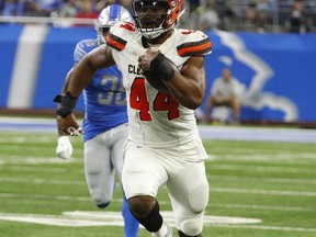 Cleveland Browns defensive end Nate Orchard (44) returns an interception for a 64-yard touchdown during the first half of an NFL football preseason game against the Detroit Lions, Thursday, Aug. 30, 2018, in Detroit.