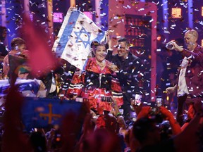 FILE - In this May 12, 2018 file photo, Netta Barzilai from Israel celebrates after winning the Eurovision song contest in Lisbon, Portugal. The Eurovision Song Contest has announced that next year's competition will be held in Tel Aviv. The government initially insisted on holding the popular event in Jerusalem. But following a backlash over the U.S. recognition of Jerusalem as its capital and a subsequent fear of boycotts it dropped the demand.