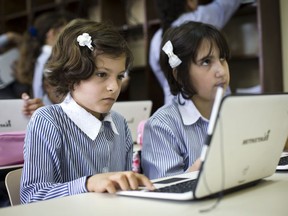 In this Saturday, Sep. 8, 2018 photo, Palestinian children use laptops at the Ziad Abu Ein School in the West Bank city of Ramallah. Palestinian educators are preparing for the future, hoping the use of technology and the arts will create new opportunities. It's a revolution of sorts for the Palestinians, who like other Arab societies have long relied on schools that stress rote memorization and obedience over research, creativity and critical thinking.