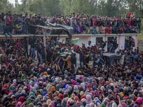 Kashmiri villagers carry body of top rebel commander Gulzar Ahmed Paddroo during his funeral procession in Aridgeen, about 75 kilometers south of Srinagar, Indian controlled Kashmir, Saturday, Sept 15, 2018. Indian troops laid a siege around a southern village in Qazigund area overnight on a tip that militants were hiding there, police said. A fierce gunbattle erupted early Saturday, and hours later, five local Kashmiri rebels were killed.