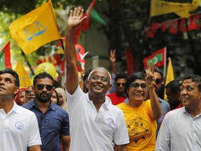 Maldives' opposition presidential candidate Ibrahim Mohamed Solih, center, waves as he walks in a street march with supporters in Male, Maldives, Saturday, Sept. 22, 2018. Solih, the only contender in Sunday's election against incumbent President Yameen Abdul Gayoom, is backed by former President Mohamed Nasheed who is now living in exile in neighboring Sri Lanka.