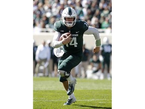 Michigan State quarterback Brian Lewerke runs for a touchdown against Central Michigan during the second quarter of an NCAA college football game, Saturday, Sept. 29, 2018, in East Lansing, Mich.