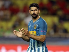 Atletico forward Diego Costa celebrates his goal during the Champions League Group A soccer match between Monaco and Atletico Madrid at the Louis II stadium in Monaco, Tuesday, Sept. 18, 2018.
