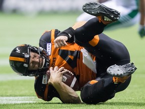 B.C. Lions' quarterback Travis Lulay tumbles ahead to avoid being hit during the second half of a CFL football game against the Saskatchewan Roughriders in Vancouver, on Saturday August 25, 2018.
