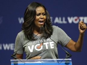 Former first lady Michelle Obama speaks at a rally to encourage voter registration on Friday, Sept. 28, 2018, in Coral Gables, Fla.