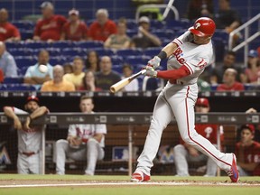 Philadelphia Phillies' Cesar Hernandez hits a single during the first inning of a baseball game against the Miami Marlins on Tuesday, Sept. 4, 2018, in Miami.