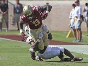 Florida State's JacquesPatrick is tackled by Northern Illinois' Jalen Embry in the first quarter of an NCAA college football game, Saturday, Sept. 22, 2018, in Tallahassee Fla.