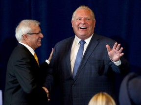 Accompanied by Ontario Finance Minister Vic Fedeli Premier Doug Ford announces his government will seek to create a select committee to investigate ìLiberal waste and scandalî at Queen's Park in Toronto, Ont. on Monday September 24, 2018.