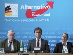 Bernd Baumann, manager of AfD Bundestag faction, is flanked by AfD's parliamentary floor leaders Alice Seidel, right, and Alexander Gauland during a press conference of the Alternative for Germany party in Berlin Tuesday, Sept. 11, 2018 where they said its leadership will meet to discuss ways of heading off a potential move by the domestic intelligence agency to put it under observation