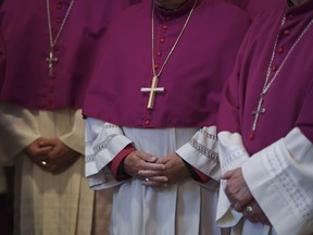 Bishops attend the opening mass of the German bishops' conference in Fulda, Germany, Tuesday, Sept. 25, 2018 where the bishops will discuss a study on sexual abuse in the Catholic church in Germany.