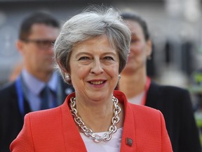 British Prime Minister Theresa May smiles when arriving at the informal EU summit in Salzburg, Austria, Thursday, Sept. 20, 2018. She became Britain's prime minister in 2016 after the country voted to leave the EU. Her entire premiership has been dedicated to ensuring the country's smooth sailing out of the European Union.