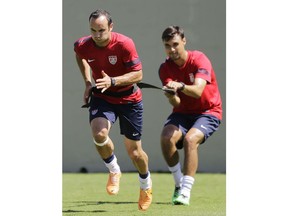 FILE - In this Jan. 22, 2014, file photo, United States' Landon Donovan, left, and teammate Chris Wondolowski train in Sao Paulo, Brazil. Wondolowski, who played in college at tiny, Division II Chico State, is on the cusp of the MLS all-time goals record, held by Landon Donovan, arguably the greatest U.S. player ever.