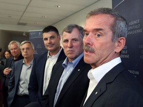 Canadian astronaut Chris Hadfield talks to the media as astronaut colleagues look on after gather on stage at Ottawa University to talk to students about their experiences in Ottawa, Friday September 21,2018. From right to left Chris Hatfield, David Williamson,Jeremy Hansen, Robert Thirsk, and Bjarni Tryggvason.