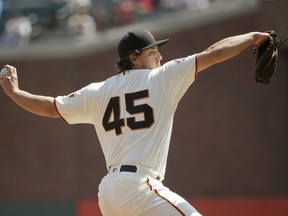 San Francisco Giants starting pitcher Derek Holland works in the first inning of a baseball game against the Atlanta Braves Wednesday, Sept. 12, 2018, in San Francisco.