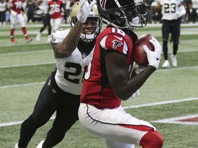 Atlanta Falcons wide receiver Calvin Ridley catches a touchdown pass past New Orleans Saints cornerback P.J. Williams during the first quarter of an NFL football game  Sunday, Sept 23, 2018, in Atlanta.