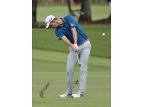 Justin Rose hits from the third fairway during the third round of the Tour Championship golf tournament Saturday, Sept. 22, 2018, in Atlanta.