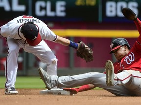 Washington Nationals' Juan Soto, right, steals second base as Atlanta Braves shortstop Dansby Swanson, left, tries to tag him during the fourth inning of a baseball game Saturday, Sept. 15, 2018, in Atlanta.