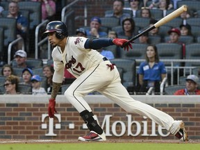 Atlanta Braves' Johan Camargo watches his infield single during the eighth inning of a baseball game against the Pittsburgh Pirates on Sunday, Sept. 2, 2018, in Atlanta. The Braves won 5-1.