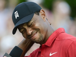 Tiger Woods tries to maintain his composure while getting choked up being interviewed after winning the Tour Championship golf tournament Sunday, Sept. 23, 2018, in Atlanta.